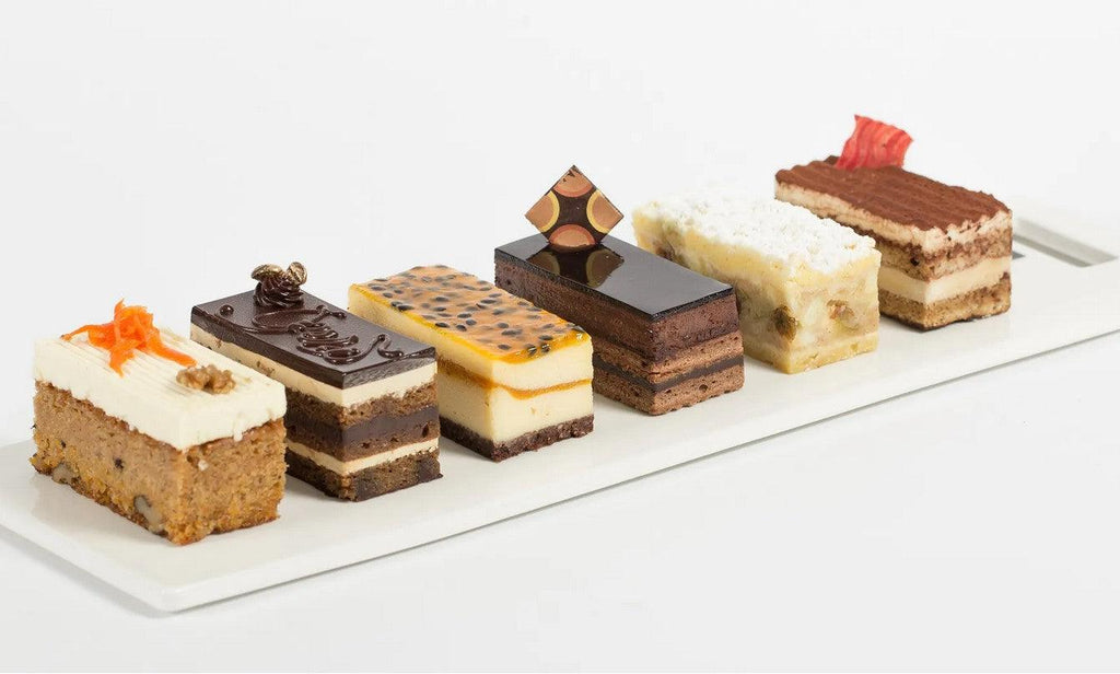 6 Pack of assorted cake slices including Apple Crumble, Opera Gateux, Carrot, Chocolate Mousse, Mango Passion Cheesecake and Raspberry white choc