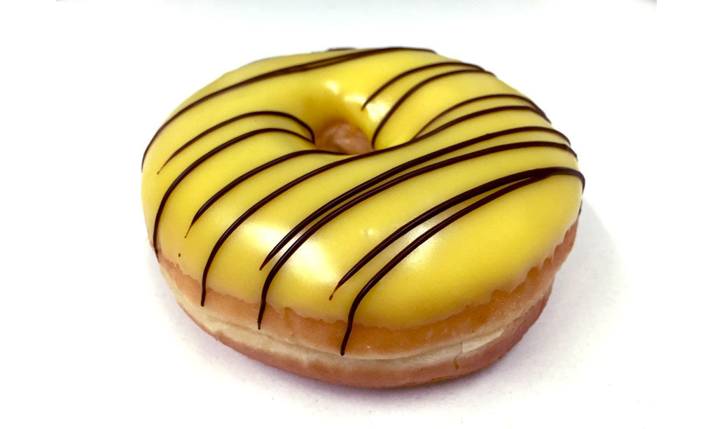 FRESHLY MADE BANANA DONUT WITH CHOCOLATE DRIZZLED ON TOP