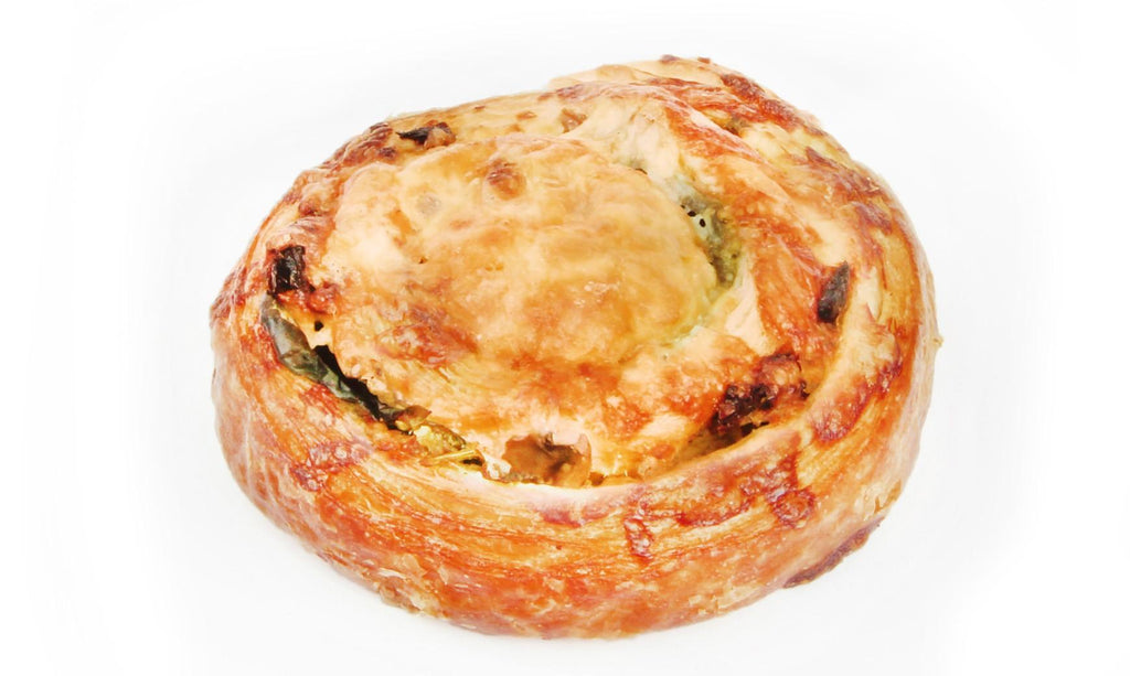 Mediterranean Swirl with Flaky Croissant pastry swirled with fresh basil pesto, baby spinach, mushrooms, sundried tomatoes, crumbled feta and golden tasty cheese