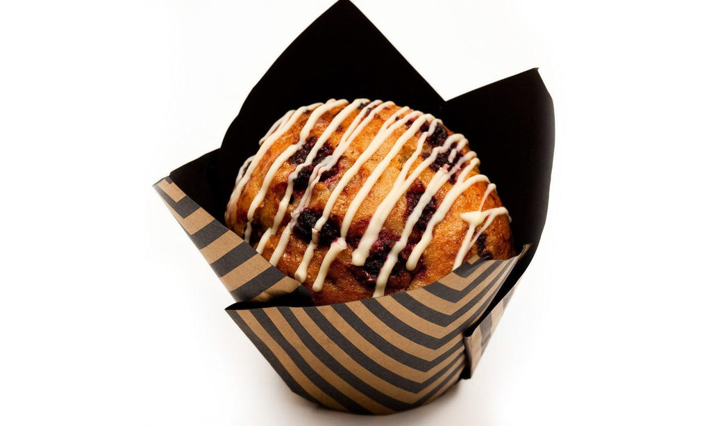 Raspberry and white chocolate Muffin drizzled with white glaze