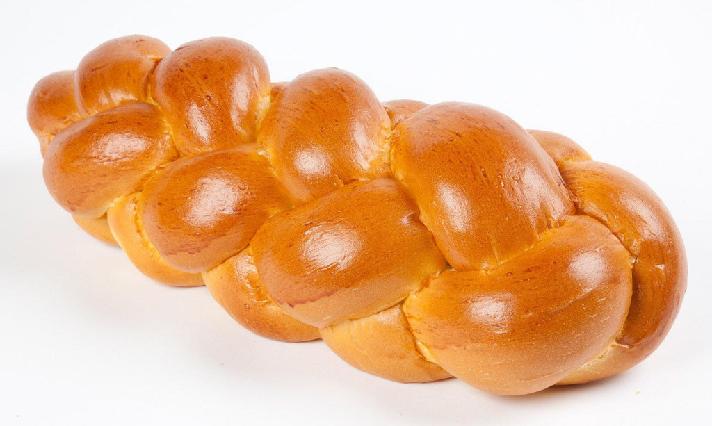 Brioche plaited Jewish Challah Loaf, this non-kosher bread is lighter in texture and has a golden egg-wash sheen