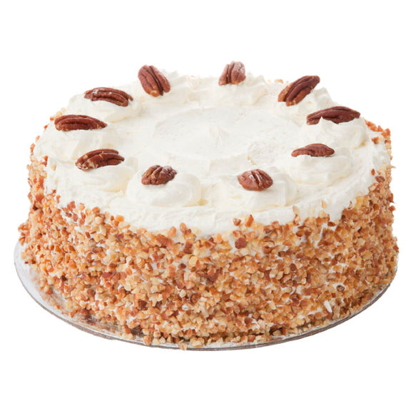 Mezzapica Traditional Banana Cake - Layers of banana cake sponge centered and finished with a cream cheese mix and chopped nuts on sides.