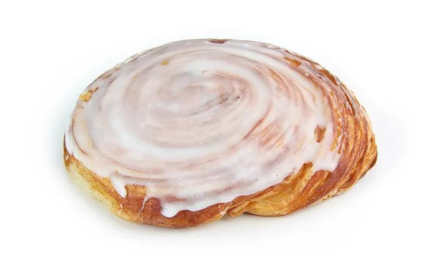 Large round Flaky Cinnamon Swirl covered with icing