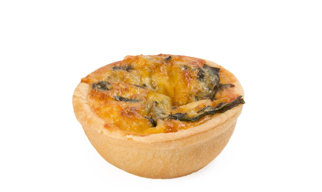 Cocktail Quiche Florentine Spinach made from a base of buttery shortcrust pastry filled with eggs, cream and wilted spinach.