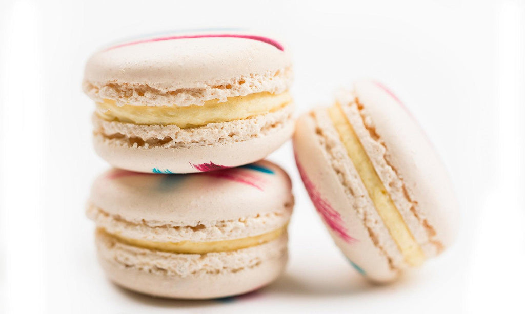 French Vanilla Macarons in box of 12 and painted with French flair and filled with the soft sophistication of vanilla buttercream. 