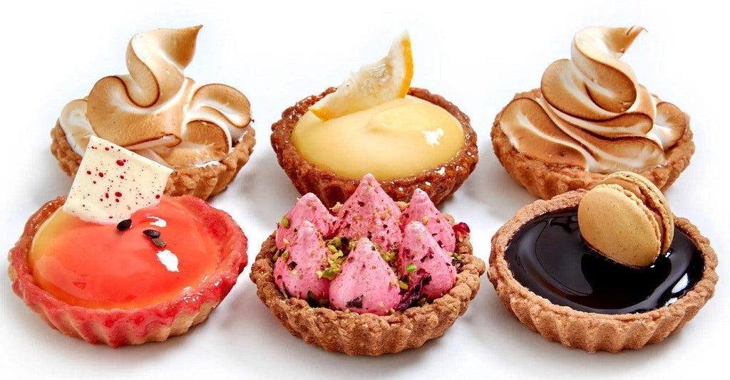 Small deluxe tarts which are colourful and flavours include Passionfruit tart, lemon miringue tart, lemon lime tart, Cherry Ripe tart and salted caramel macaron tart in a box of 6