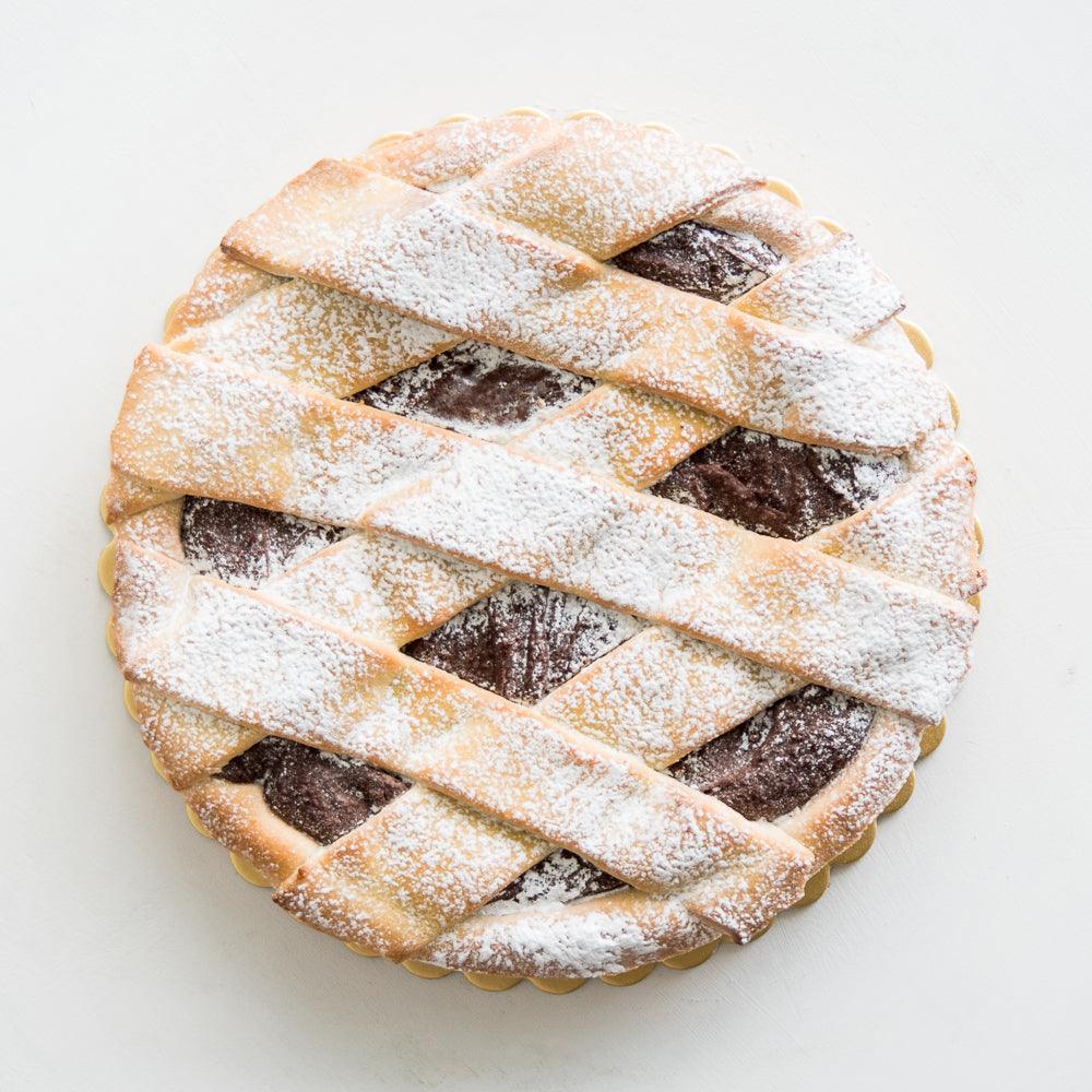 Pasticceria Papa’s Chocolate Crostata is made with a short crust pastry base, chocolate hazelnut filling and finished with a light dusting of icing sugar.