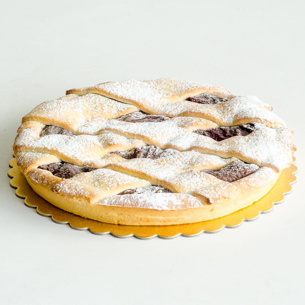 Pasticceria Papa’s Chocolate Crostata is made with a short crust pastry base, chocolate hazelnut filling and finished with a light dusting of icing sugar.