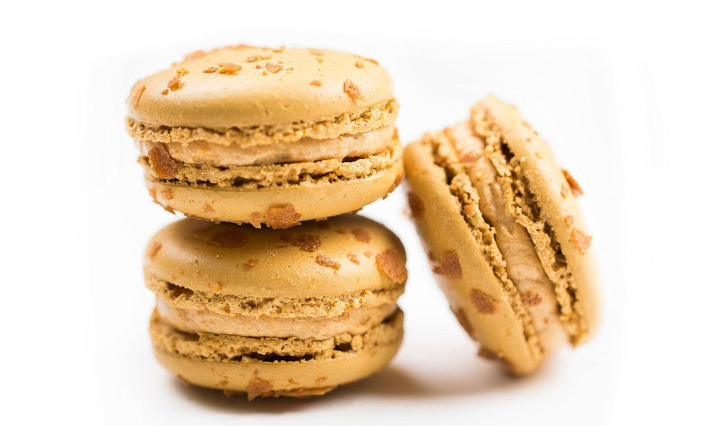 Salted Caramel Macarons made with Two tiny mounds of almond meringue sandwiched, between smooth salted caramel buttercream in pack of 12