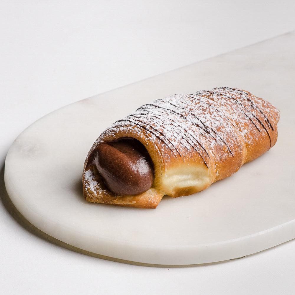 Pasticceria Papa’s Chocolate Custard Horn and covered with soft pastry and chocolate drizzle