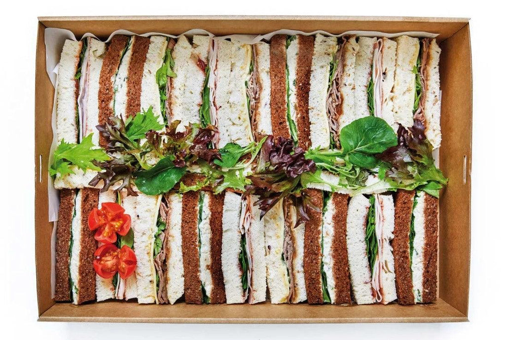 Finger Sandwiches in catering box with three flavours; Herb chicken on Rye bread, Turkey on White bread,  Roast Beef on Multigrain bread
